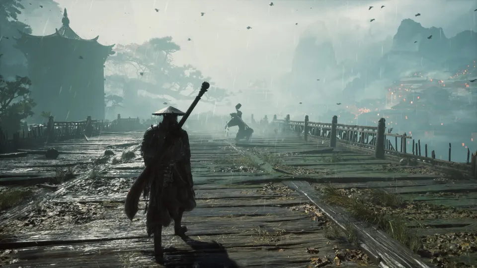 A straw-hatted warrior crosses a rain-soaked bridge toward distant mountains and buildings in Phantom Blade Zero.